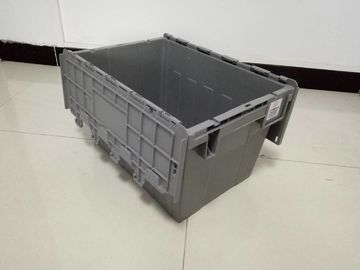 黄色いプラスチック収納用の箱は交通機関のために積み重なったふたを付けた